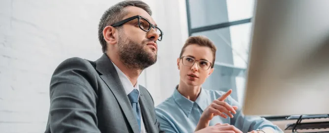 Business professionals discussing IT staffing strategies, representing the choice between staff augmentation and managed services for optimal business solutions.