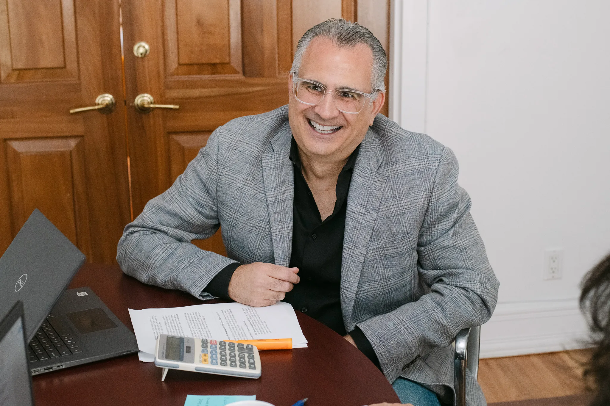 Senior IT recruitment executive consulting with a client about technology staffing and hiring solutions