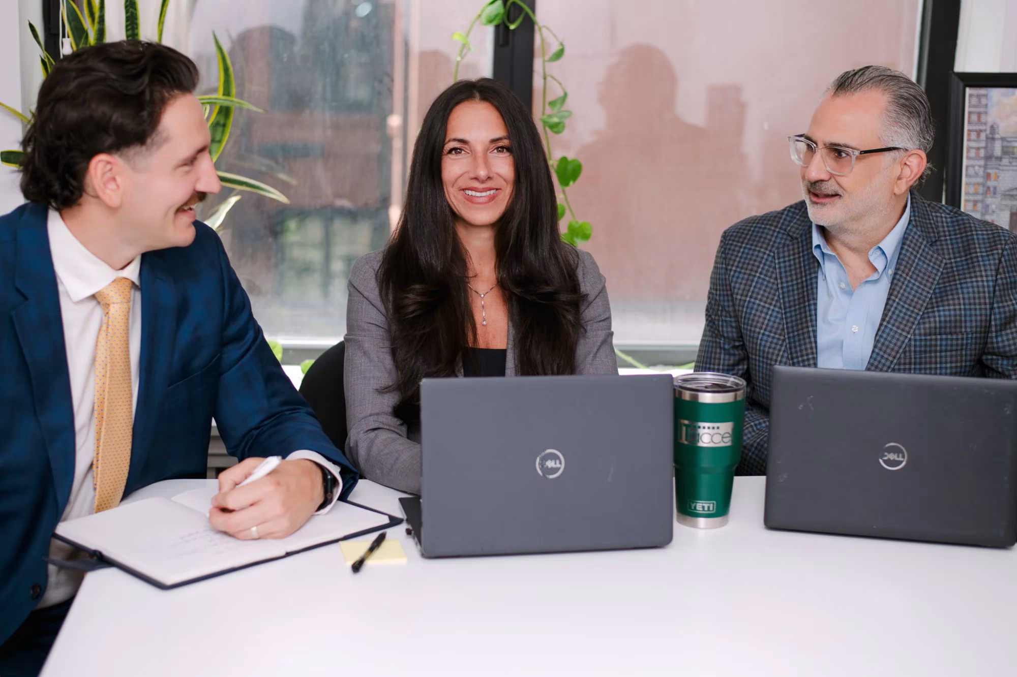 IT Accel team meeting with a client around a conference table in their New York office